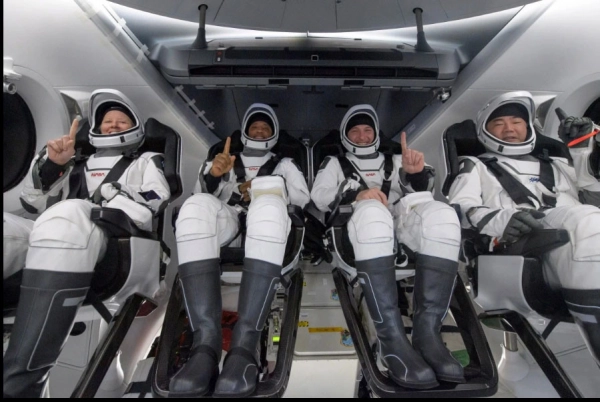 NASA astronauts inside the SpaceX Crew Dragon Resilience spacecraft