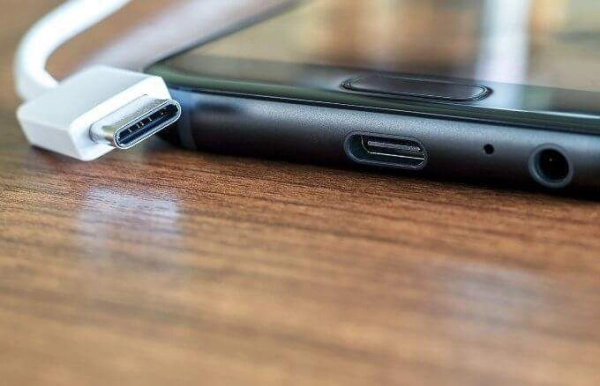 To connect your phone to your TV via USB, plug one end of the device into the TV's USB port and the other end into your phone